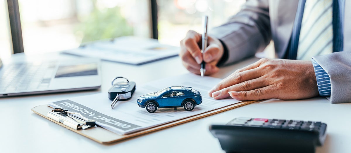 Car purchase paperwork and keys